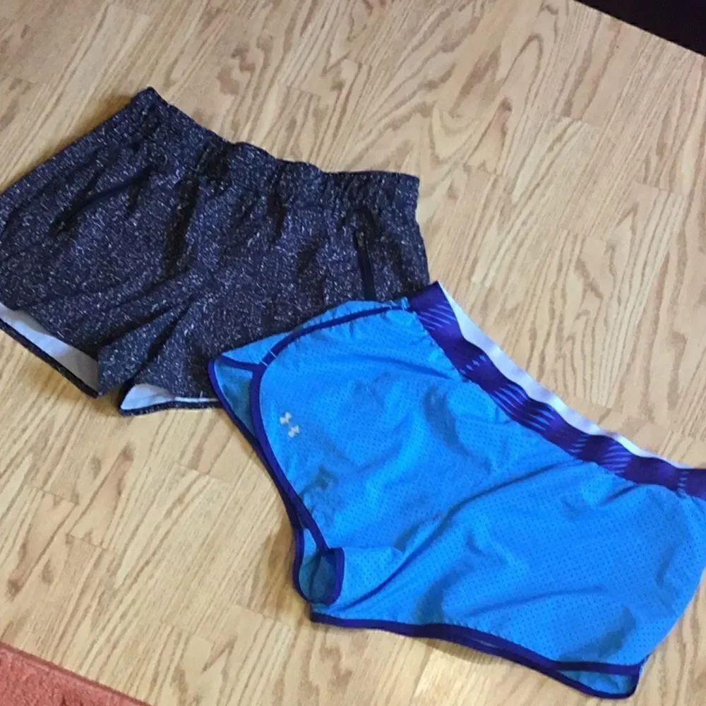 2 pair athletic shorts, both size medium, 1 blue, 1 black & white